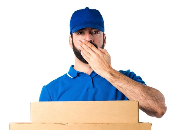 Delivery man covering his mouth — Stock Photo, Image