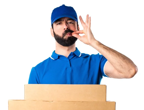 Delivery man making silence gesture — Stock Photo, Image