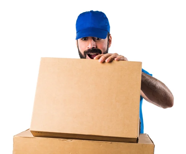 Delivery man doing surprise gesture — Stock Photo, Image
