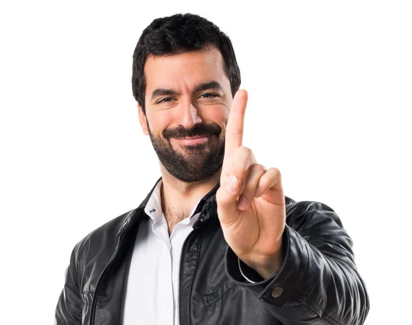 Man with leather jacket counting one — Stock Photo, Image
