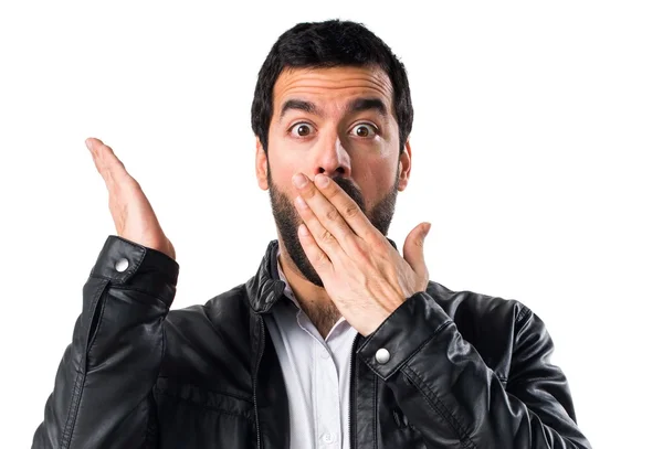 Man with leather jacket doing surprise gesture — Stock Photo, Image