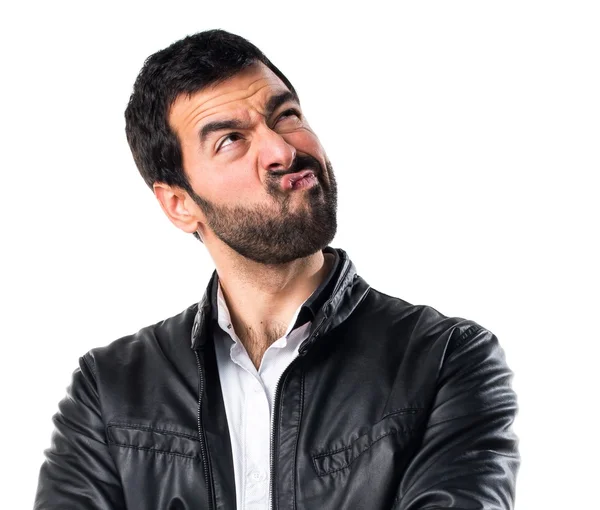 Man with leather jacket having doubts — Stock Photo, Image