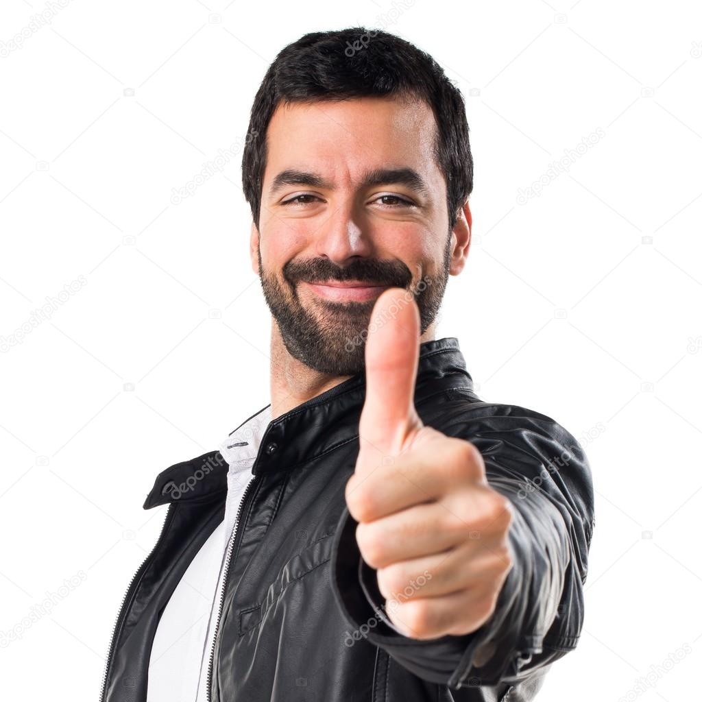 Man with leather jacket with thumb up