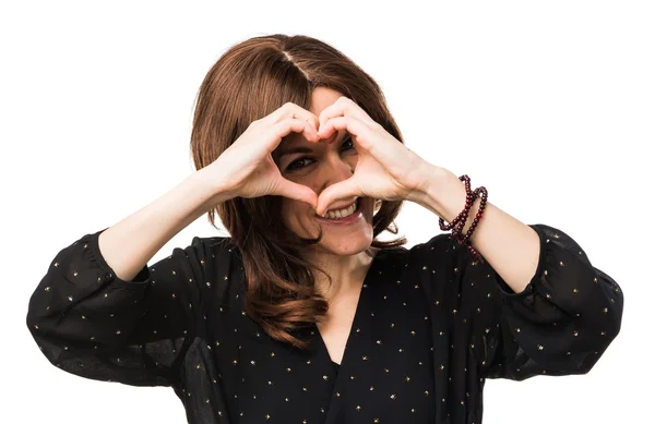 Woman making a heart with her hands — Stock Photo, Image