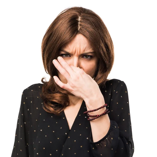 Woman making smelling bad gesture — Stock Photo, Image