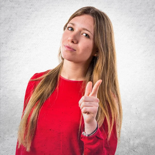 Teen girl pointing to the front — Stock Photo, Image