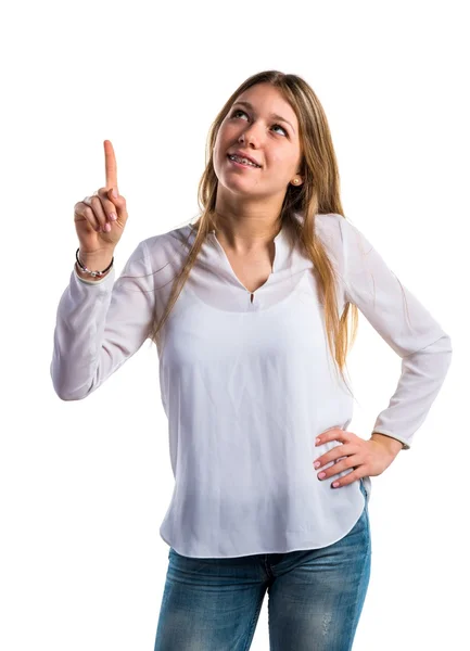 Adolescente menina apontando para cima — Fotografia de Stock