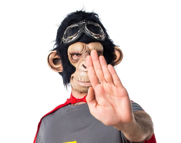 Superhero monkey man making stop sign — Stock Photo, Image