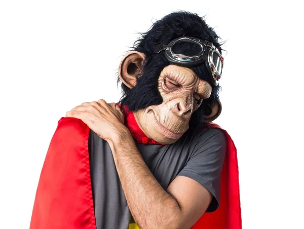Hombre mono superhéroe con dolor de espalda —  Fotos de Stock