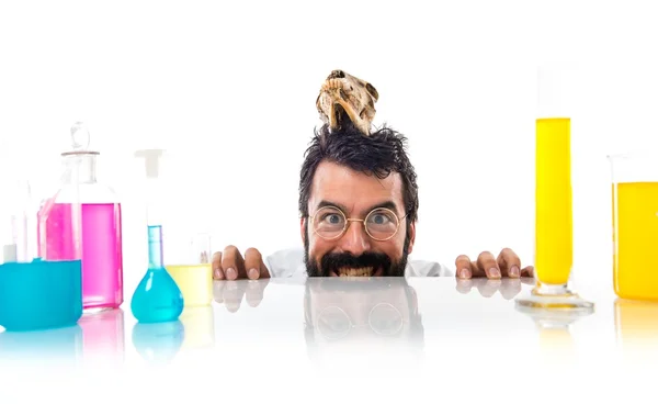 Crazy scientist man with skull — Stock Photo, Image