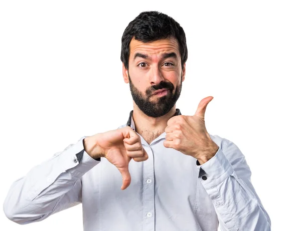 Man making good-bad sign — Stock Photo, Image