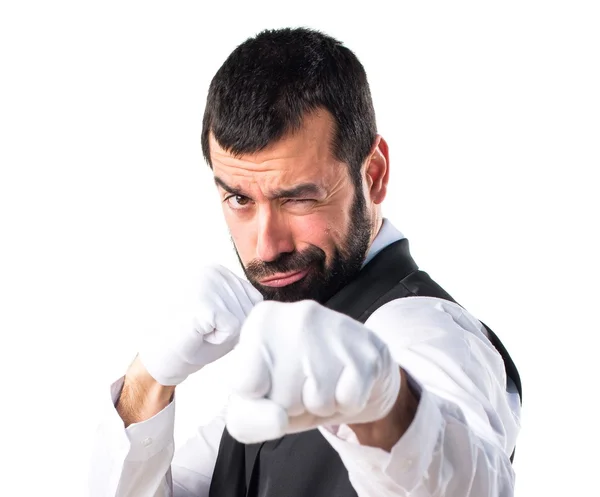 Luxury waiter giving a punch — Stock Photo, Image