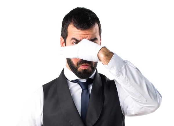 Luxury waiter making smelling bad gesture — Stock Photo, Image