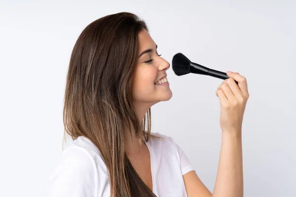 Adolescente Chica Sobre Aislado Fondo Celebración Maquillaje Cepillo Whit Feliz — Foto de Stock
