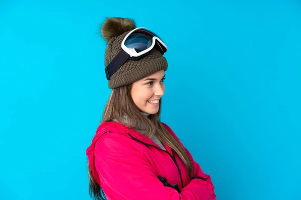 Teenager Skier Girl Snowboarding Glasses Isolated Blue Background Looking Side — Stock Photo, Image