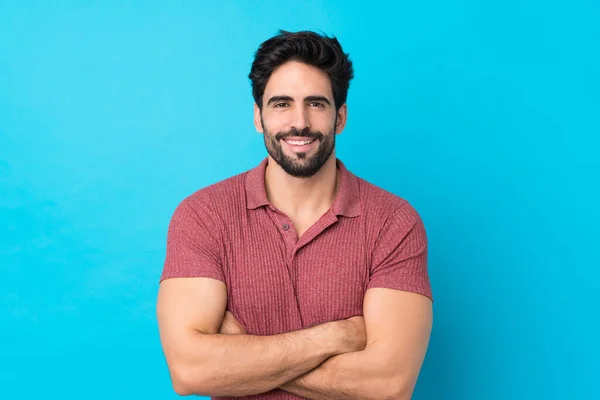 Joven Hombre Guapo Con Barba Sobre Fondo Azul Aislado Manteniendo — Foto de Stock