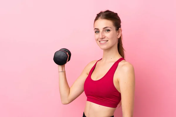 Junge Sportlerin Über Isolierten Rosa Hintergrund Macht Gewichtheben — Stockfoto