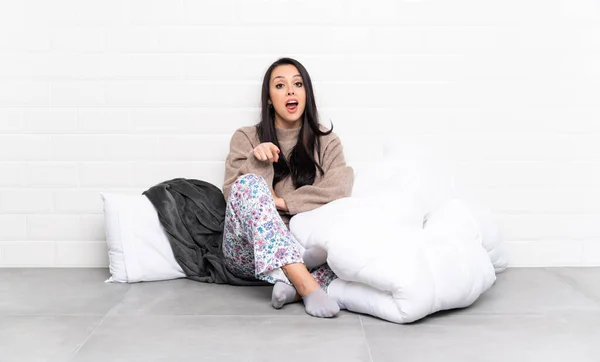 Young Colombian Girl Pajamas Indoors Surprised Pointing Front — Stock Photo, Image