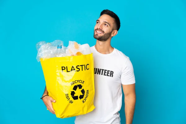 Young Caucasian Man Holding Bag Full Plastic Bottles Recycle Isolated — Stock Photo, Image