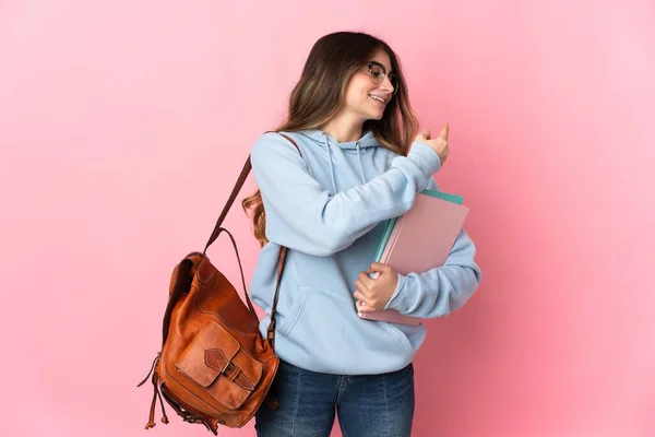 Junge Studentin Isoliert Auf Rosa Hintergrund Zeigt Zurück — Stockfoto