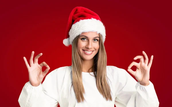 Dívka Vánoční Klobouk Přes Izolované Pozadí Ukazující Znamení Prsty — Stock fotografie
