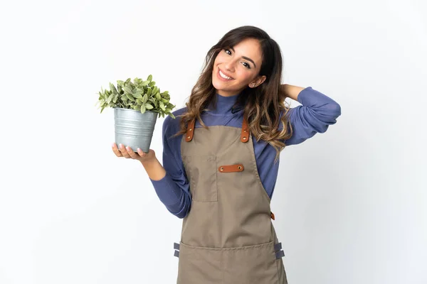 Niña Jardinero Sosteniendo Una Planta Aislada Sobre Fondo Blanco Riendo — Foto de Stock