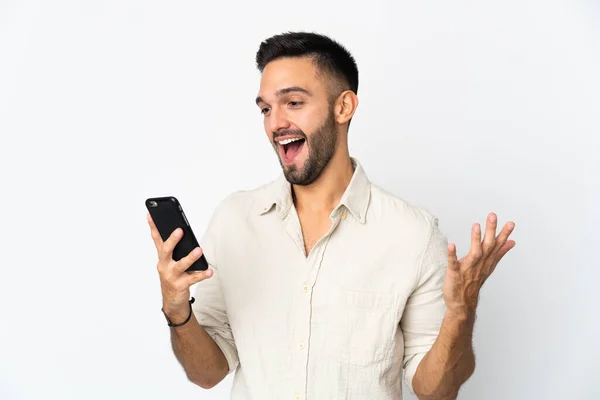 Young Caucasian Man Isolated White Background Looking Camera While Using — Stock Photo, Image