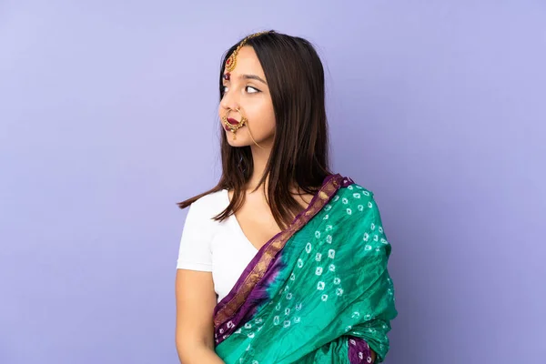 Young Indian Woman Isolated Purple Background Looking Side — Stock Photo, Image