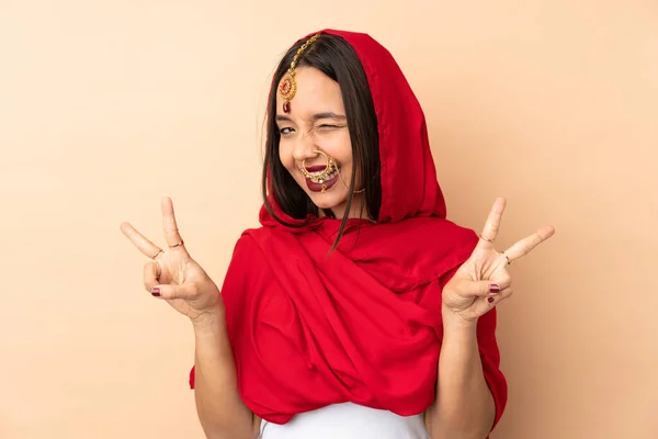 Young Indian Woman Isolated Beige Background Showing Victory Sign Both — Stock Photo, Image