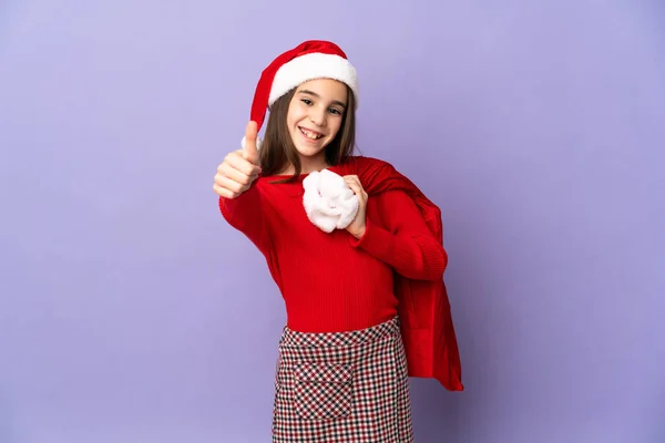 Petite Fille Avec Chapeau Sac Noël Isolé Sur Fond Violet — Photo