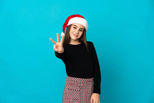 Petite Fille Avec Chapeau Noël Isolé Sur Fond Bleu Heureux — Photo