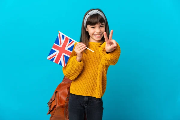 Маленька Дівчинка Яка Вивчає Англійську Ізольовану Синьому Фоні Посміхається Показує — стокове фото