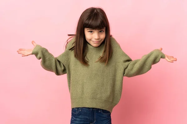 Little Girl Isolated Pink Background Having Doubts While Raising Hands — Stock Photo, Image