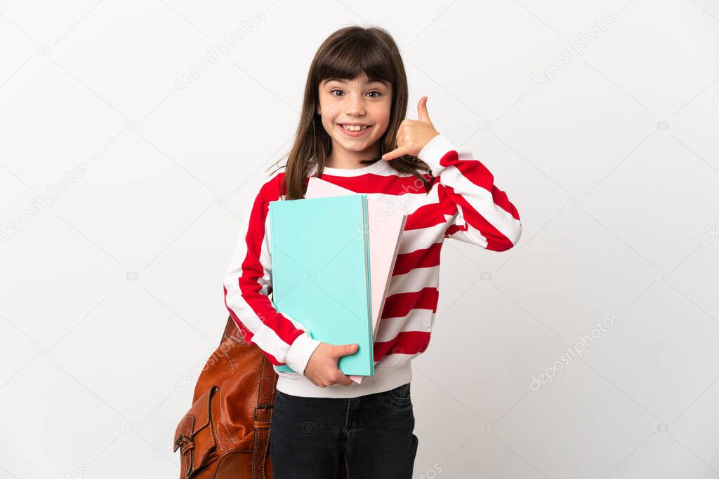 Little student girl isolated on white background making phone gesture. Call me back sign