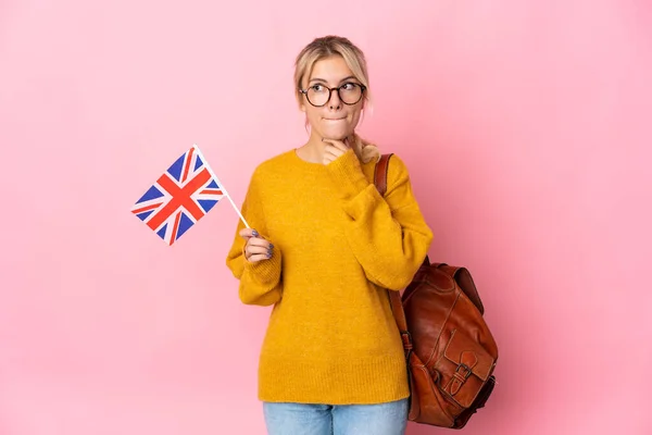 Young Russian Woman Holding United Kingdom Flag Isolated Pink Background — Stok fotoğraf