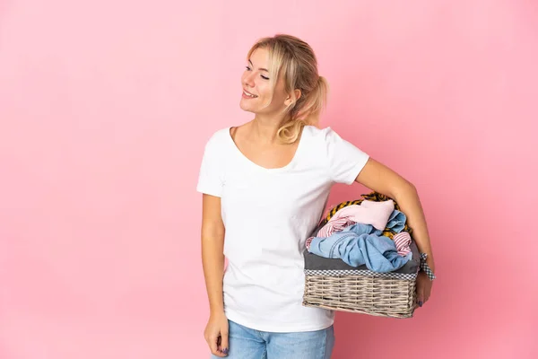 Young Russian Woman Holding Clothes Basket Isolated Pink Background Looking — Stok fotoğraf