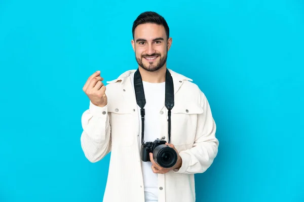 Young Photographer Man Isolated Blue Background Making Money Gesture — Stock Photo, Image