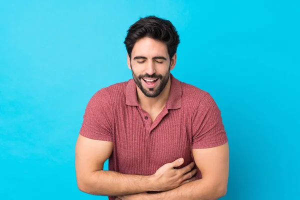 Jovem Homem Bonito Com Barba Sobre Fundo Azul Isolado Sorrindo — Fotografia de Stock