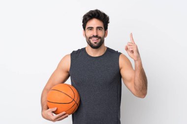 Basketbolcu, sakallı, izole edilmiş beyaz arka planı olan adam harika bir fikre işaret ediyor.