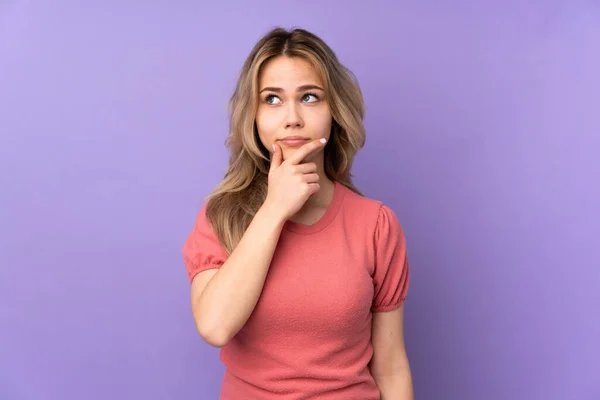 Teenager Russian Girl Isolated Purple Background Having Doubts Confuse Face — Stock Photo, Image