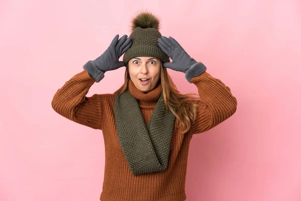 Middle Age Woman Winter Hat Isolated Pink Background Surprise Expression — Stock Photo, Image