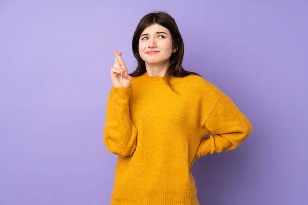 Young Ukrainian Teenager Girl Isolated Purple Background Fingers Crossing Wishing — Stock Photo, Image