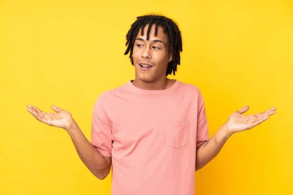 Young African American Man Isolated Yellow Background Holding Copyspace Two — Stock Photo, Image