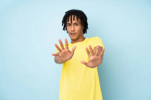 Young African American Man Isolated Blue Background Nervous Stretching Hands — Stock Photo, Image