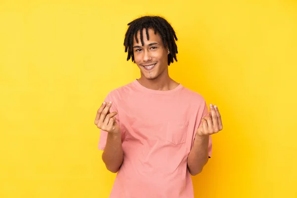 Young African American Man Isolated Yellow Background Making Money Gesture — Stock Photo, Image