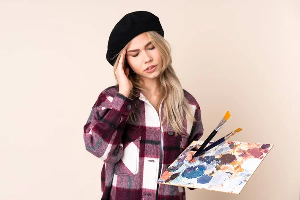 Teenager Künstler Mädchen Hält Eine Palette Isoliert Auf Blauem Hintergrund — Stockfoto