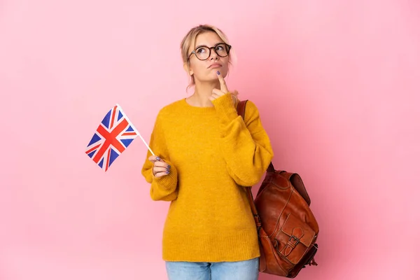 Young Russian Woman Holding United Kingdom Flag Isolated Pink Background — Stock Photo, Image