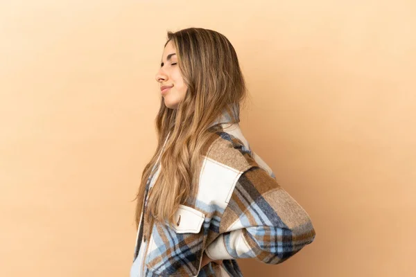 Young Caucasian Woman Isolated Beige Background Suffering Backache Having Made — Stock Photo, Image