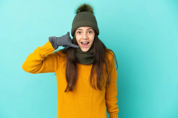 Young French Girl Isolated Blue Background Winter Hat Making Phone — Stock Photo, Image