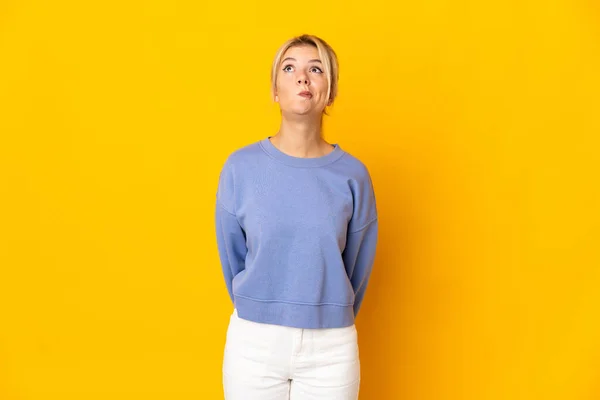 Young Russian Woman Isolated Yellow Background Looking — Stock Photo, Image